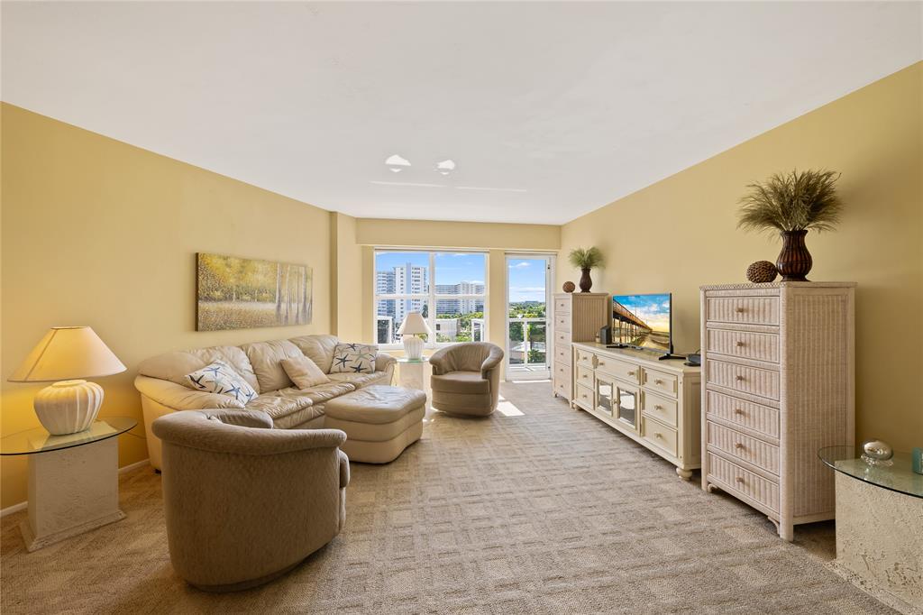 3700 Galt Ocean Drive, Unit 714 Fort Lauderdale, FL 33308 - Photo 5 of 39 a living room with furniture and a flat screen tv