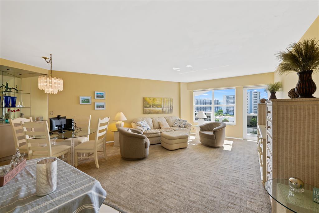 3700 Galt Ocean Drive, Unit 714 Fort Lauderdale, FL 33308 - Photo 7 of 39 a living room with furniture and a large window