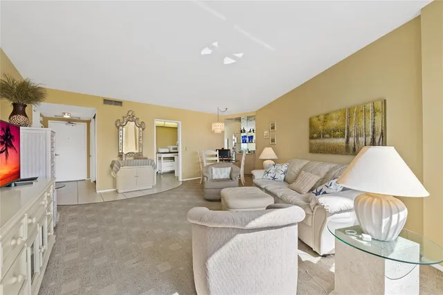 a living room with furniture and a table