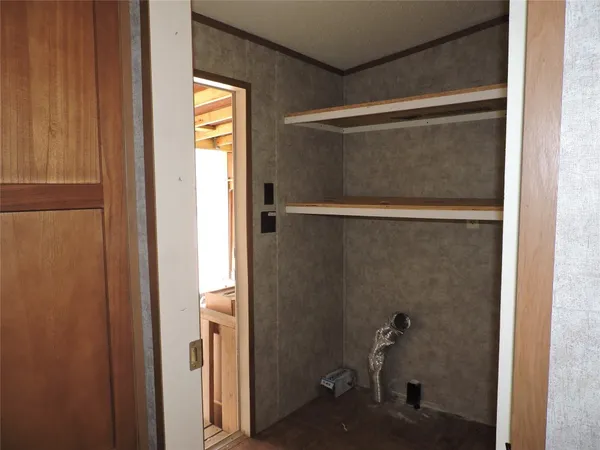 a kitchen with cabinets and window