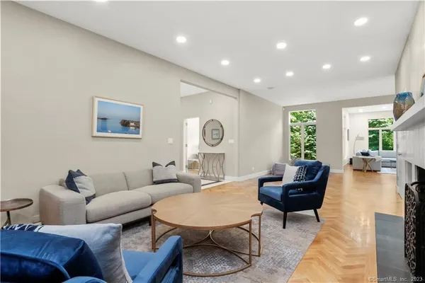 a living room with furniture and a large window
