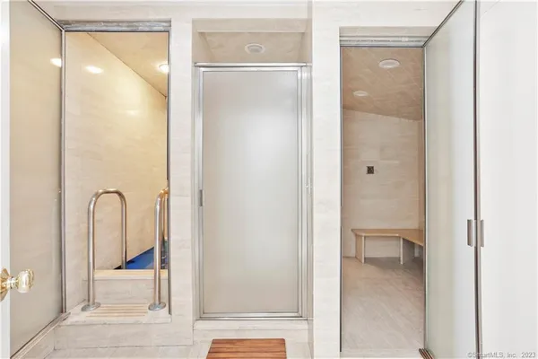 a view of a bathroom from a corridor