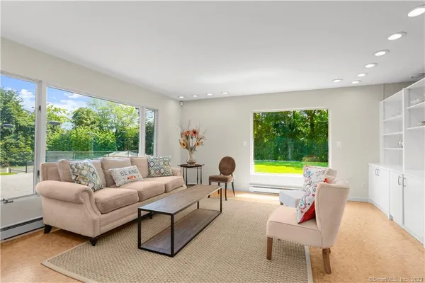 a living room with furniture and a large window
