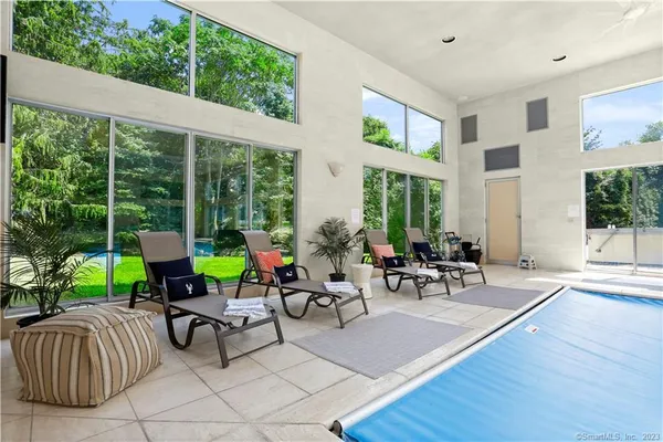 a view of a patio with chairs and table in patio