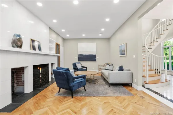 a living room with furniture and a fireplace