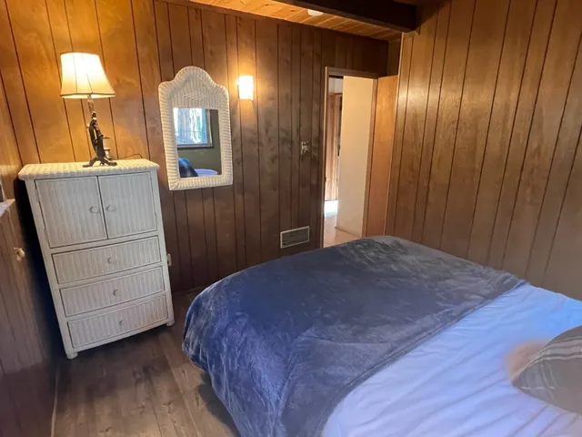 a living room with furniture a rug and a table