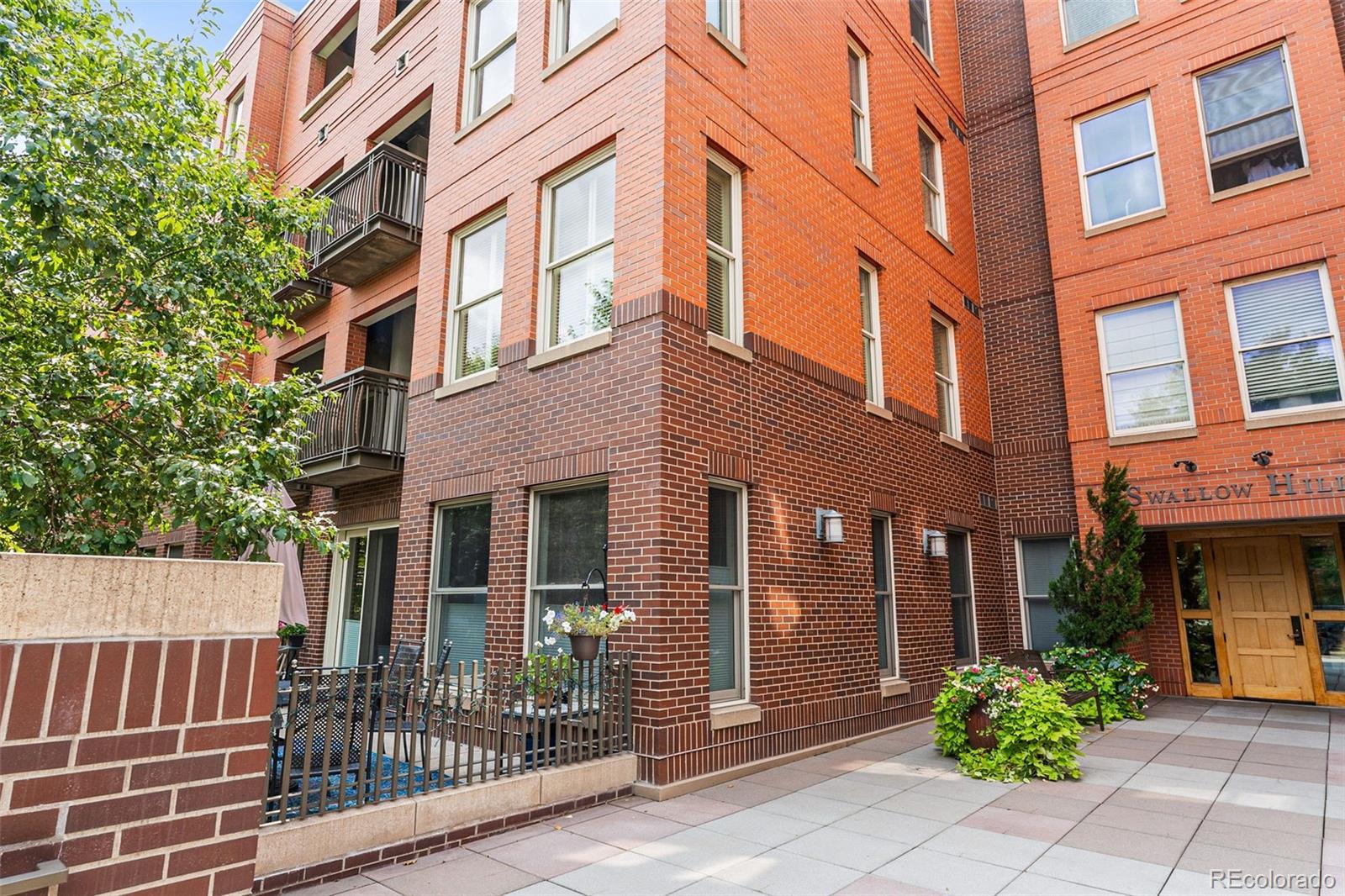 1631 Emerson Street, Unit 207 Denver, CO 80218 - Photo 2 of 31 front view of a brick building