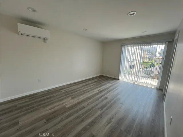 a view of kitchen with refrigerator microwave and stove