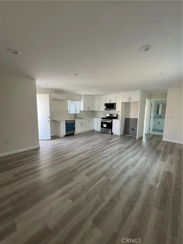 a bathroom with a shower sink and mirror