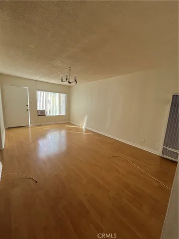 a kitchen with granite countertop a refrigerator and a sink