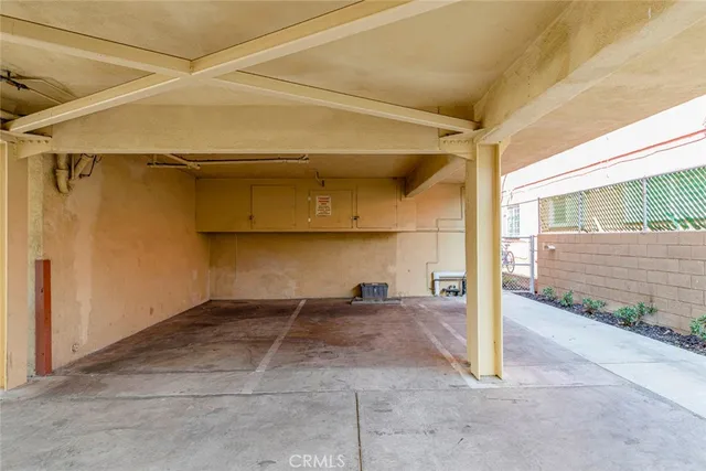 a view of a storage and utility room with washer and dryer