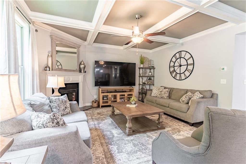 3041 Vista Ridge Braselton, GA 30517 - Photo 11 of 56 a living room with furniture a large window and a fireplace