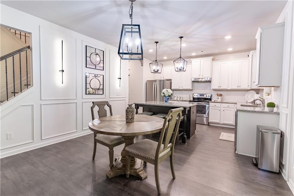 3041 Vista Ridge Braselton, GA 30517 - Photo 15 of 56 a view of kitchen with cabinets table and chairs