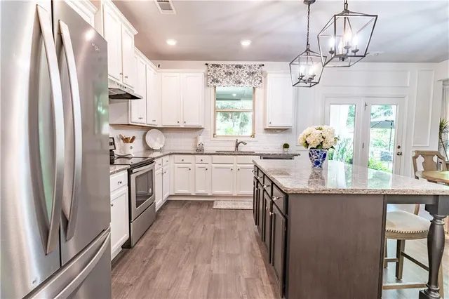 a bathroom with a sink a mirror and a window