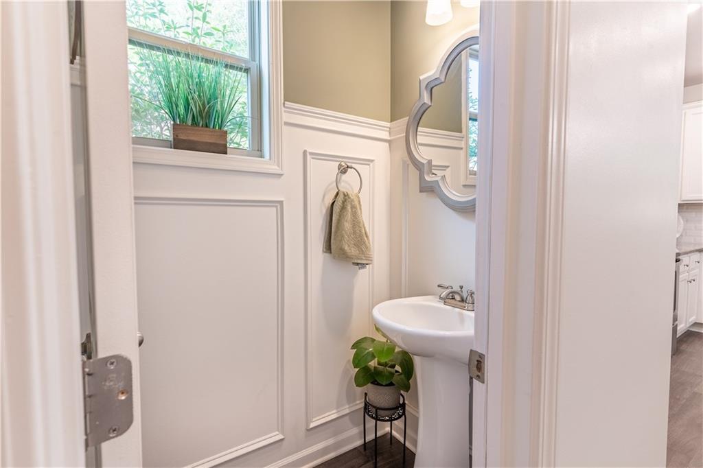 3041 Vista Ridge Braselton, GA 30517 - Photo 20 of 56 a bathroom with a sink a mirror and a window