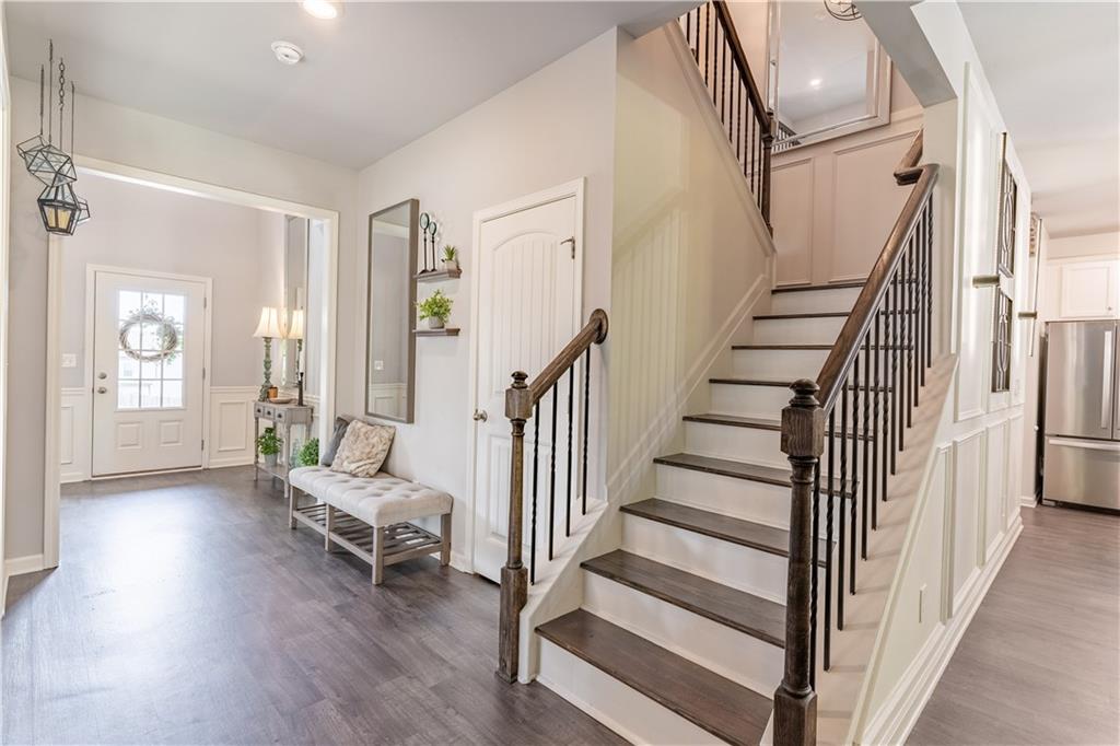 3041 Vista Ridge Braselton, GA 30517 - Photo 21 of 56 a view of entryway with wooden floor and stairs
