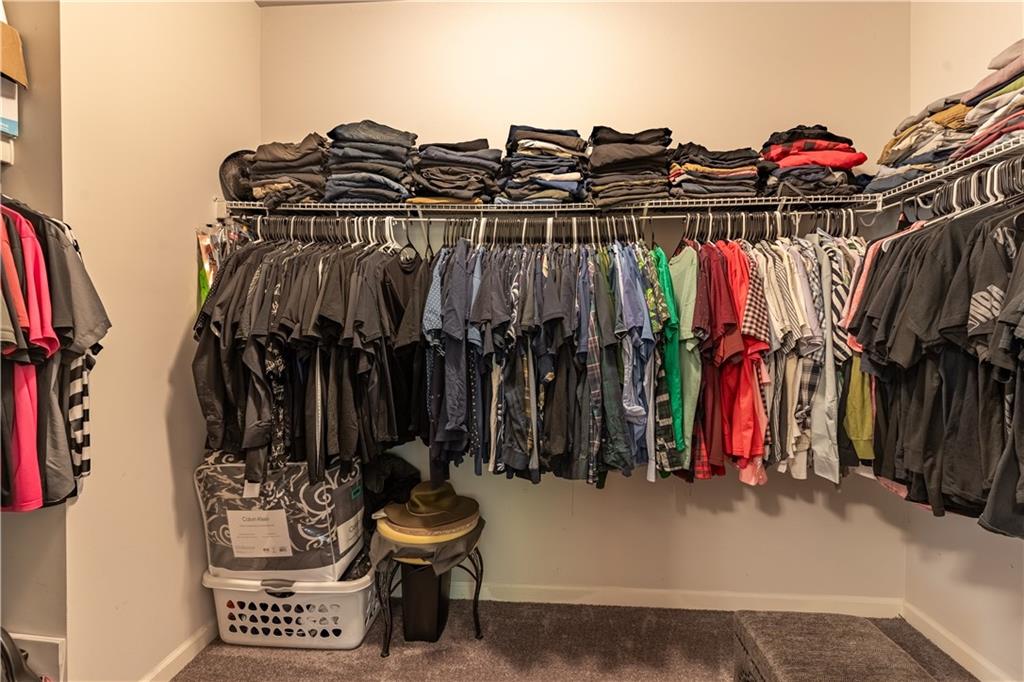 3041 Vista Ridge Braselton, GA 30517 - Photo 25 of 56 a view of walk in closet with clothes and shoes