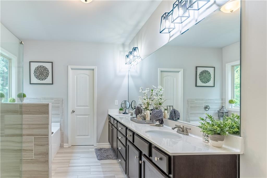 3041 Vista Ridge Braselton, GA 30517 - Photo 27 of 56 a bathroom with a sink and a mirror