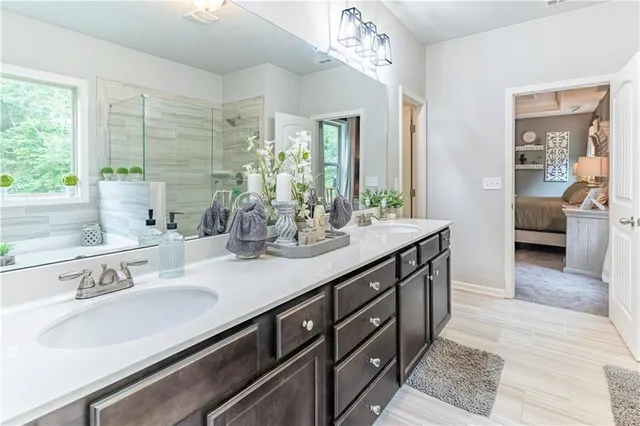 a bathroom with a sink and a window