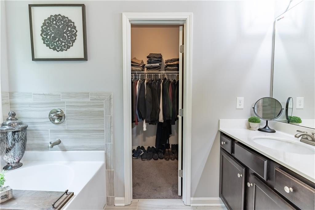 3041 Vista Ridge Braselton, GA 30517 - Photo 31 of 56 a bathroom with a sink and a mirror