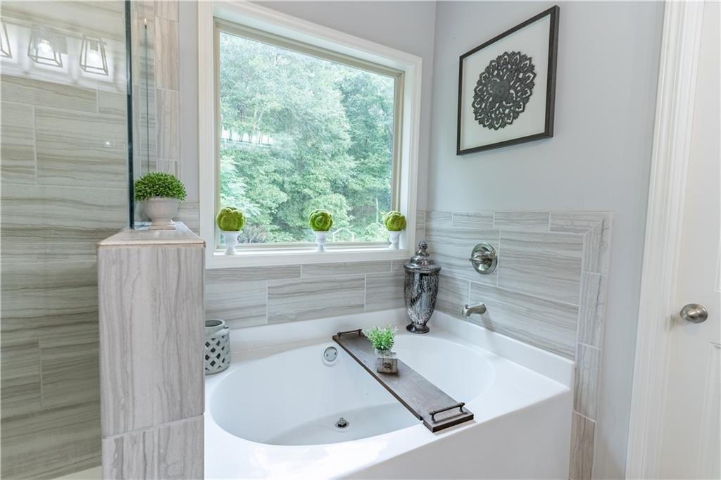 3041 Vista Ridge Braselton, GA 30517 - Photo 32 of 56 a bathroom with a sink and a window