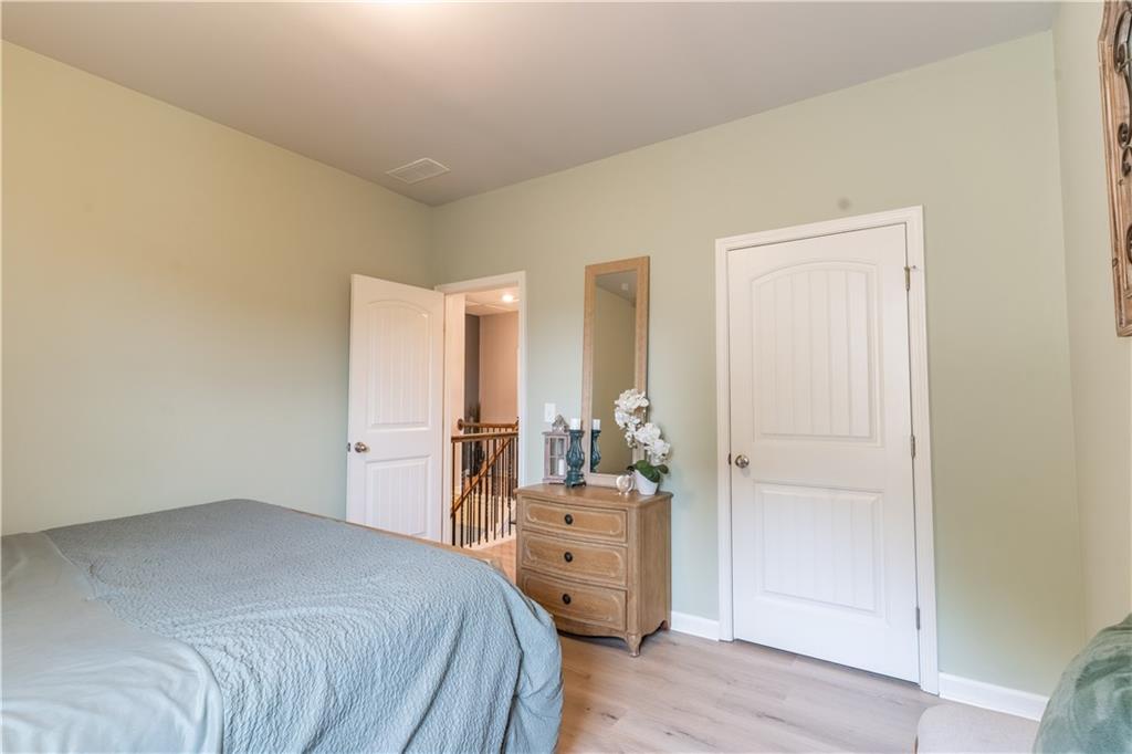 3041 Vista Ridge Braselton, GA 30517 - Photo 34 of 56 a bedroom with a bed and a closet