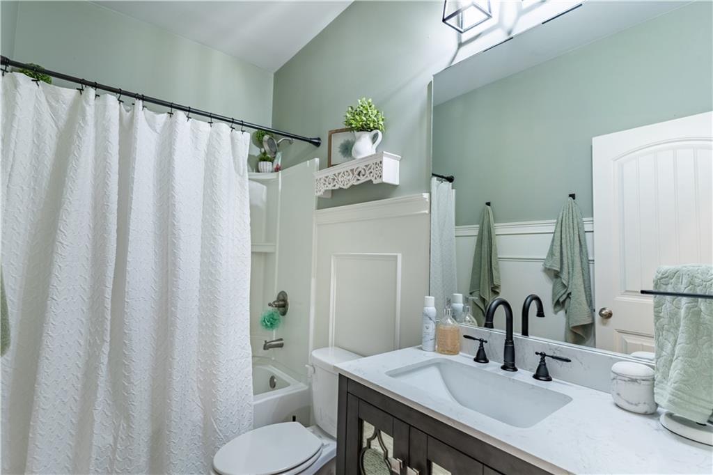 3041 Vista Ridge Braselton, GA 30517 - Photo 35 of 56 a bathroom with a sink and a mirror