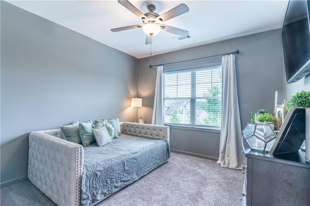 3041 Vista Ridge Braselton, GA 30517 - Photo 36 of 56 a bedroom with a bed and window