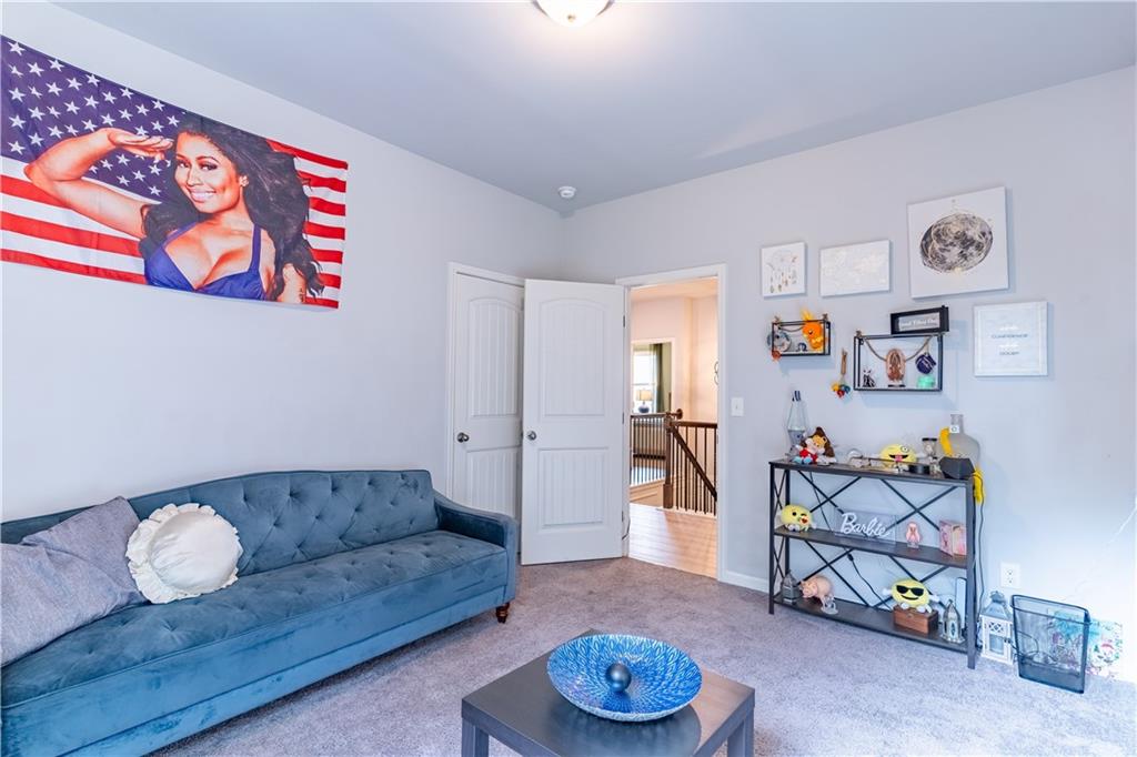 3041 Vista Ridge Braselton, GA 30517 - Photo 40 of 56 a living room with furniture and wooden floor
