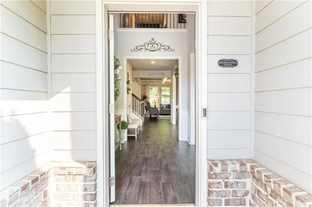 a view of an entryway with wooden floor