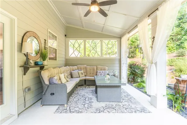 a view of backyard of house with seating space