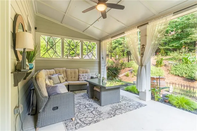 a front view of a house with a yard and fountain