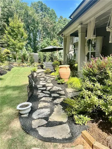 a backyard of a house with lots of green space