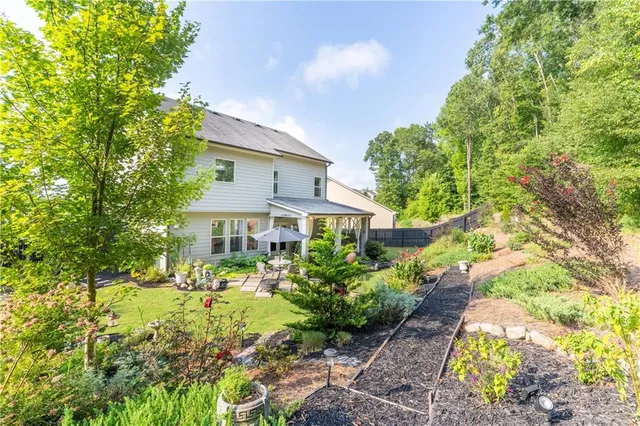 a front view of house with yard outdoor seating