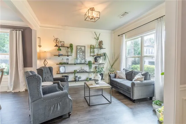 a view of a dining room with furniture window and wooden floor