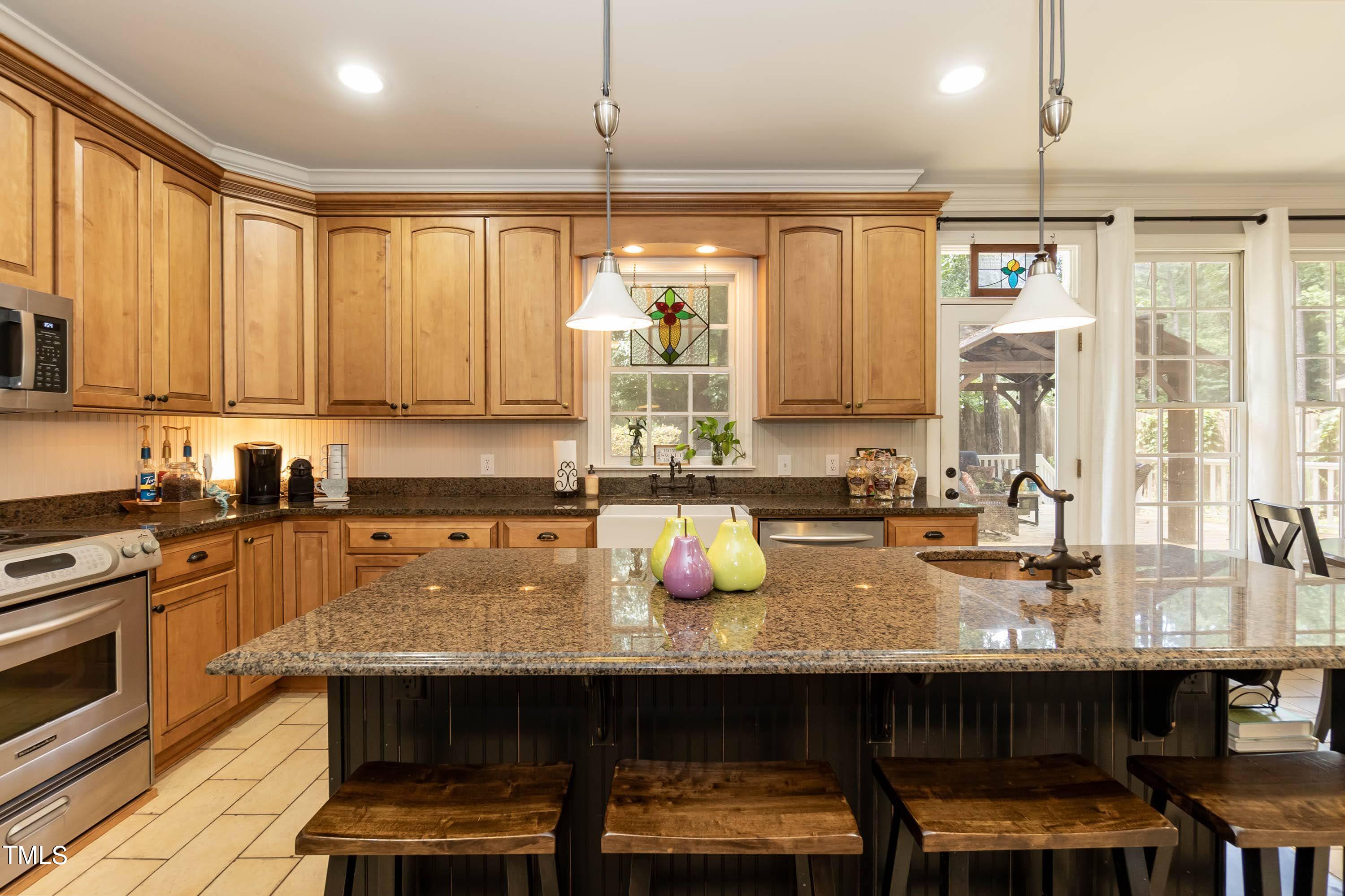 4112 Ridgebrook Bluffs Drive Raleigh, NC 27603 - Photo 20 of 40 42" cabinets with soft close drawers and granite counters
