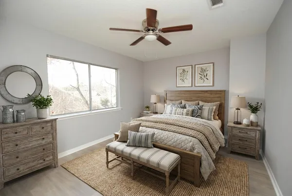 a bedroom with a bed dresser and a window