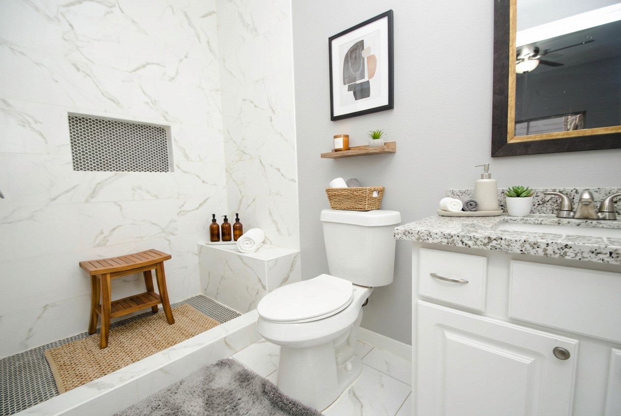 7514 Danehill Drive Spring, TX 77389 - Photo 18 of 19 a bathroom with a granite countertop toilet sink and mirror