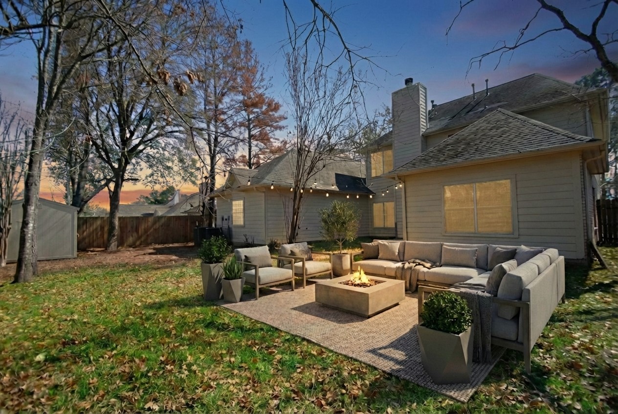 7514 Danehill Drive Spring, TX 77389 - Photo 19 of 19 a view of a patio with couches fire pit and a big yard