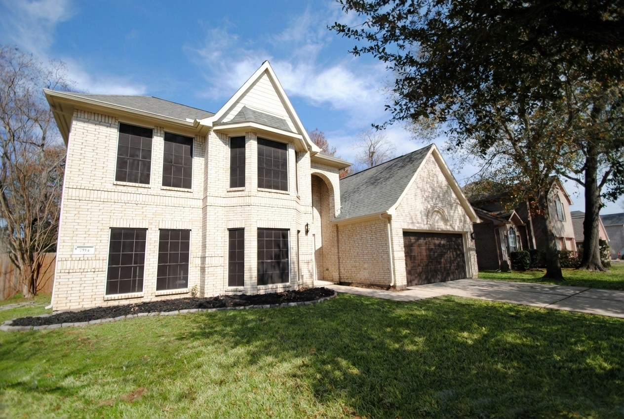 7514 Danehill Drive Spring, TX 77389 - Photo 2 of 19 front view of a house with a yard