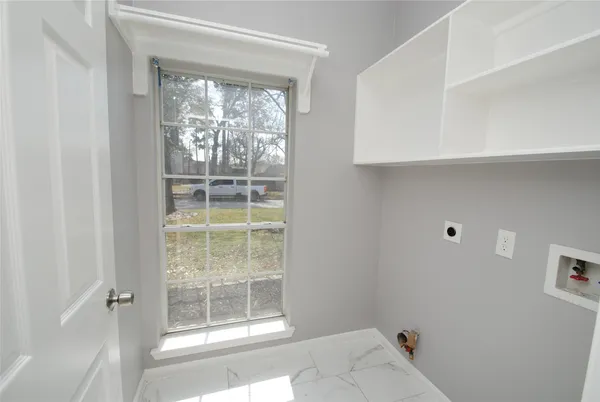 a view of wooden floor and cabinet in a room