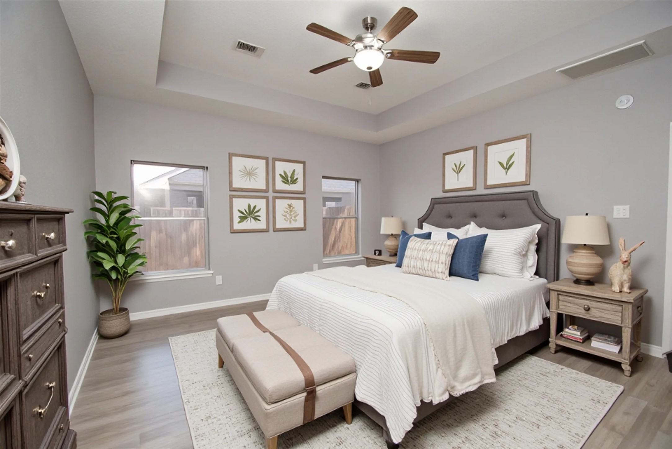 7514 Danehill Drive Spring, TX 77389 - Photo 9 of 19 a spacious bedroom with a bed and a chandelier