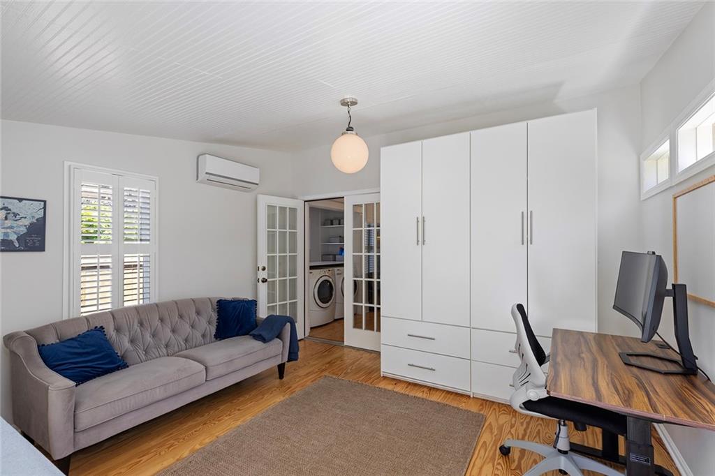 320 Ferguson Street Northeast Atlanta, GA 30307 - Photo 18 of 28 a living room with furniture a desk and chair with wooden floor