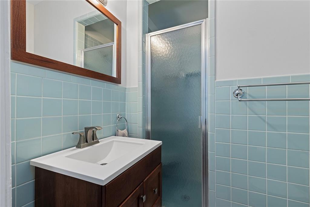 320 Ferguson Street Northeast Atlanta, GA 30307 - Photo 21 of 28 a bathroom with a sink mirror and vanity