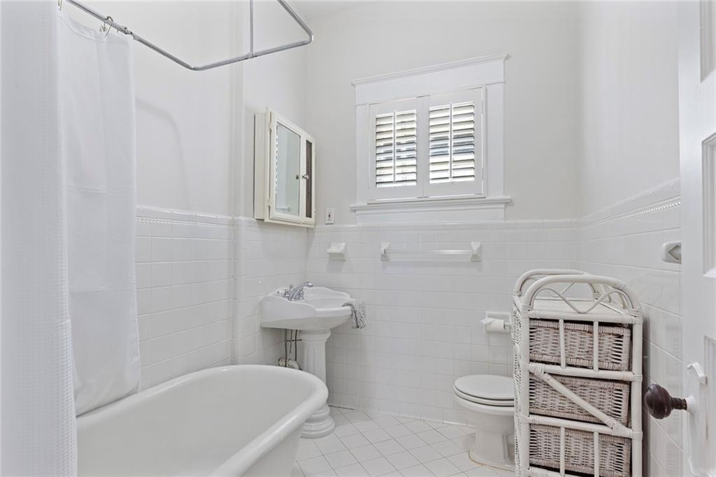 320 Ferguson Street Northeast Atlanta, GA 30307 - Photo 23 of 28 a bathroom with a toilet a sink and a bathtub