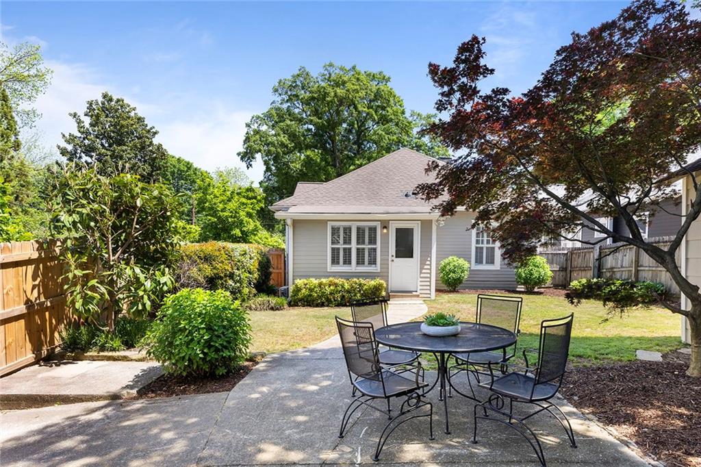 320 Ferguson Street Northeast Atlanta, GA 30307 - Photo 25 of 28 a backyard of a house with table and chairs