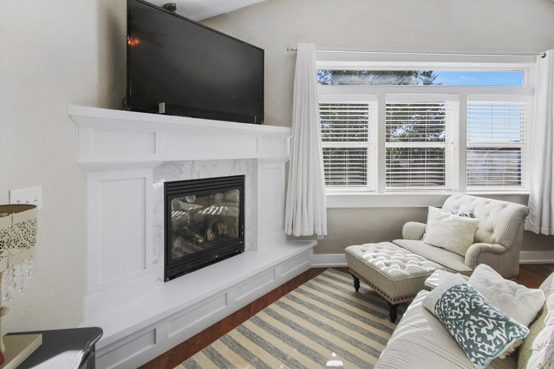 893 Ridgeview Drive Eagle Point, OR 97524 - Photo 23 of 49 a living room with furniture a flat screen tv and a fireplace
