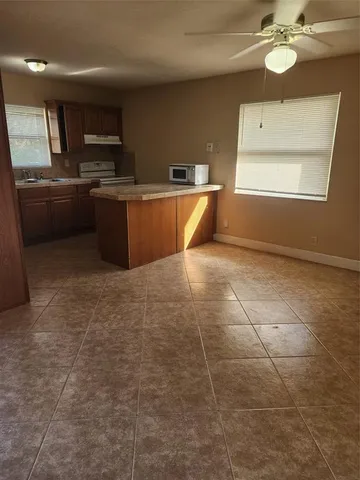 a view of a kitchen with a sink