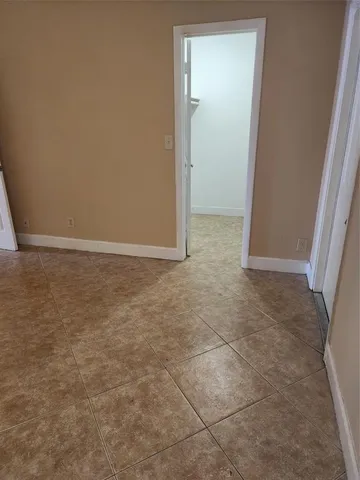 an empty room with an entryway