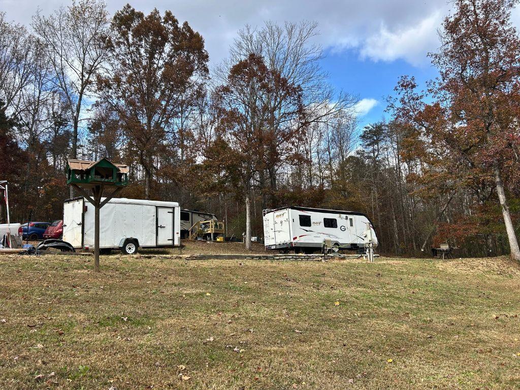 152 Rocket Drive Cleveland, GA 30528 - Photo 8 of 12 a white house that has a tree in front of it